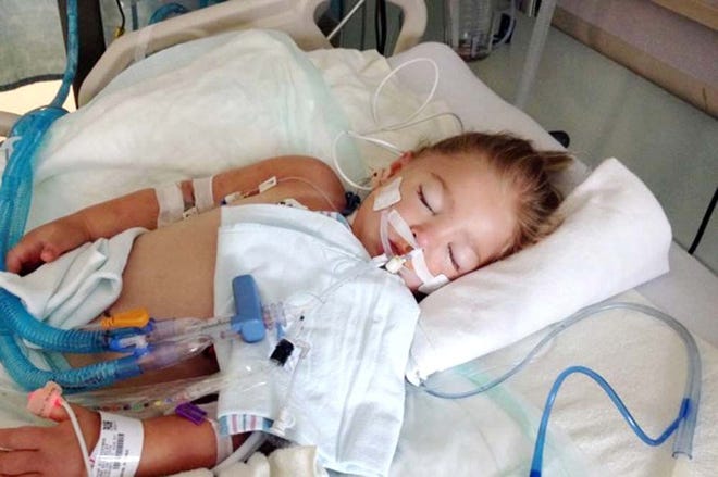 Phiona Grym lies heavily sedated at Sacred Heart Hospital in Pensacola. The 3-year-old is fighting a staph infection, which has spread through her body.