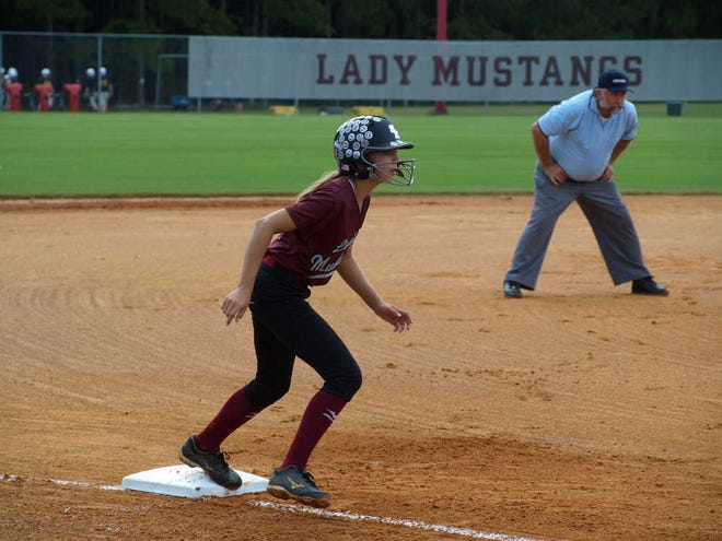 Photo courtesy of Michelle MillerMadelyn Smith looks to steals home in an SEMS Lady Mustang win in region play.