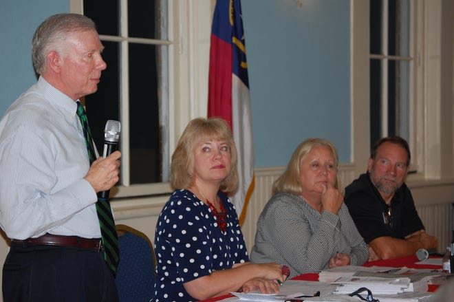 Craven County Board of Elections Chairman Gary Clemmons, left, answers questions at a election forum Tuesday night sponsored by Coastal Carolina Taxpayers Association. Also from left are Meloni Wray, elections director, Civitas Institute election policy analyst Susan Myrick, event guest speaker, and CCTA President Rick Hopkins.