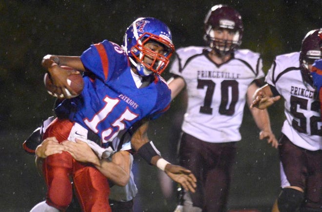 Peoria Heights quarterback Martarius Haywood runs the ball during a game against Princeville earlier this season. The Patriots travel to South Fulton on Friday.
