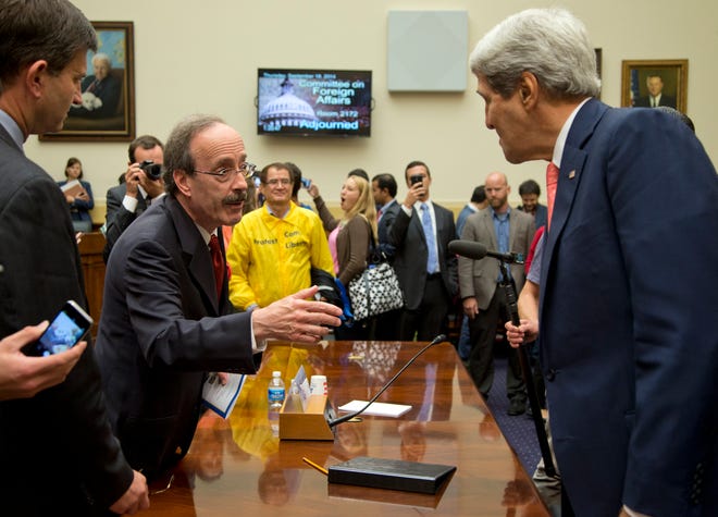 Secretary of State John Kerry, right, speaks with House Foreign Affairs Committee ranking member Rep. Eliot Engel, D-N.Y., on Capitol Hill in Washington, Thursday, Sept. 18, 2014, after a House Foreign Affairs Committee hearing.