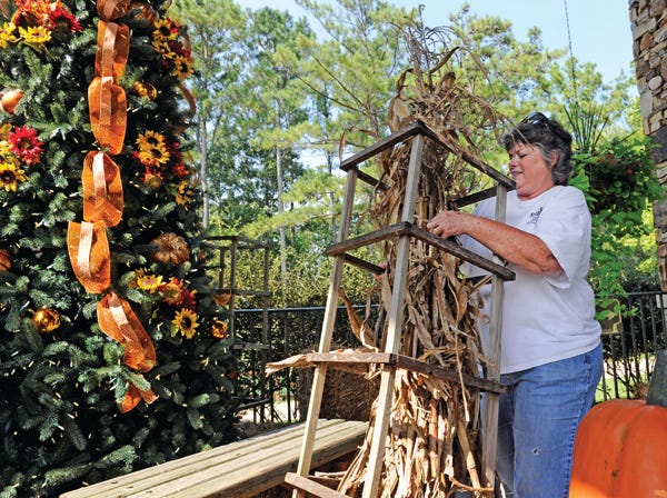 Cookie Watson decorates the entryway to the gift shop at Noccalula Falls on Thursday. The Halloween Super Bash is from 2 p.m. to 5 p.m.Oct. 11 at Noccalula Falls.