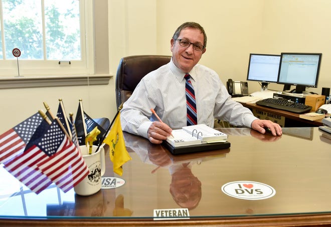 Peter Mirandi, director of Public Health, poses for a photo at his desk inside Danvers Town Hall. Wicked Local Staff Photo / David Sokol