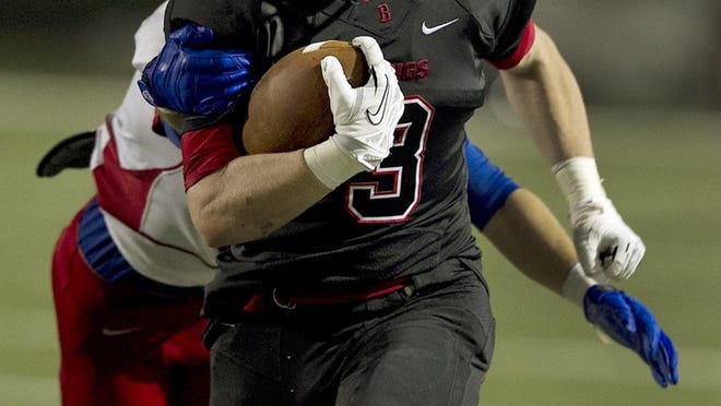 Bowie running back Cole Myers picks up yardage during a 2013 game against Westlake. A leg injury has sidelined Myers for the rest of the regular season.