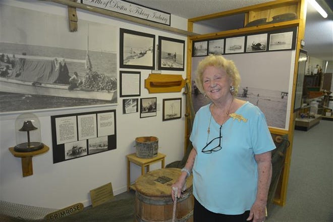 Destin History and Fishing Museum Director, Jean Melvin stands in the indoor exhibit for the Primrose.