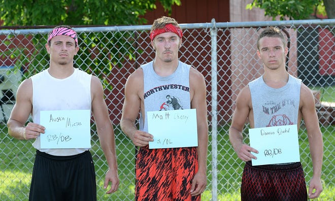From left, Northwestern High School RB/DB Austin Miczo, OL/DL Matt Cherry and RB/DB Damius Diehl are photographed in Albion on July 1. GREG WOHLFORD/