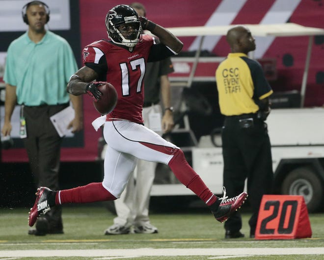 Atlanta Falcons wide receiver Devin Hester (17) moves into the end zone for a touchdown against the Tampa Bay Buccaneers during the first half of an NFL football game, Thursday, Sept. 18, 2014, in Atlanta. (AP Photo/John Bazemore)