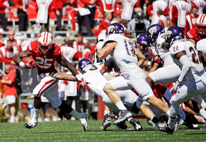 Wisconsin's Melvin Gordon runs during the second half of an NCAA college football game against Western Illinois Saturday, Sept. 6, 2014, in Madison, Wis. Wisconsin won 37-3.