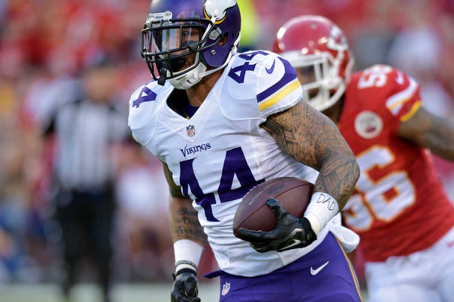 FILE - In this Aug. 23, 2014, file photo, Minnesota Vikings running back Matt Asiata carries the ball during an NFL preseason football game against the Kansas City Chiefs in Kansas City, Mo. NFL teams make succession plans all the time for players moving past their prime, but the sudden absence of Adrian Peterson from Minnesota's backfield could not have been anticipated. So the Vikings will make due with a low-profile group led by Asiata, an undrafted third-year player with 62 career carries. (AP Photo/Reed Hoffmann, File)