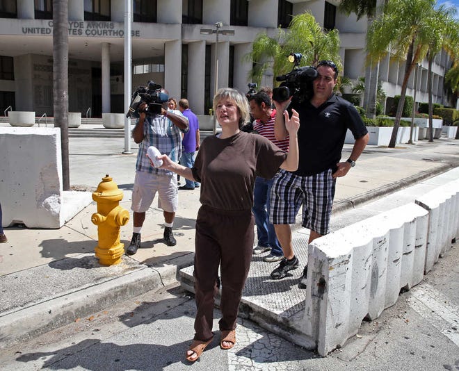 Ana Alliegro walks out of federal court Wednesday, Sept. 10, 2014, in Miami. Alliegro, a past associate of former Republican U.S. Rep. David Rivera, was sentenced to six months in jail on Wednesday for violating federal campaign finance laws. U.S. District Judge Robert Scola, who sentenced Alliegro, gave her credit for time she's already served since her arrest in March in Nicaragua, where she had fled to avoid investigators. Scola also ordered her to serve six months of home detention and two years' probation. (AP Photo/The Miami Herald, Walter Michot) MAGS OUT