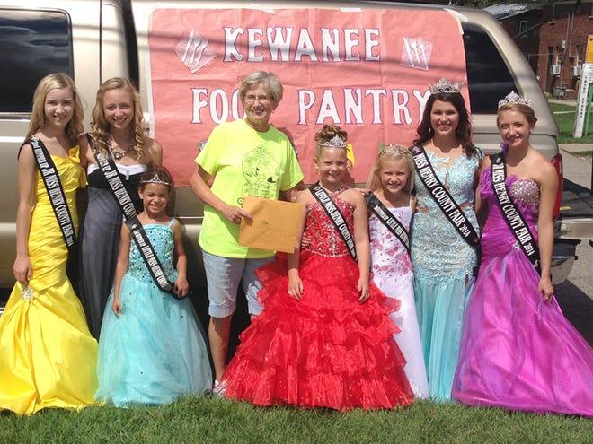 Henry County Fair royalty raised $426 in response to a recent plea for funds to make needed repairs to the Kewanee Food Pantry and presented it to Barb Gross, center, president of the food pantry board in the lineup area before both groups took part in the recent Hog Days parade From left are: Junior Miss Henry County Fair Second Runner-up Bradleigh Schaefer, Junior Miss First Runer-up Tobi Matter, Little Miss First Runner-up Leah Walker, Mrs. Gross, Little Miss Henry County Fair Caroline Girten, Little Miss Second Runner-up Kendall Ellerbrock, Miss Henry County Fair Maggie Schlindwein and Junior Miss Henry County Fair Hannah Johnson.