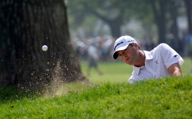 Ryan Palmer shoots out of a bunker during the third round of the BMW Championship golf tournament in Cherry Hills Village, Colo.