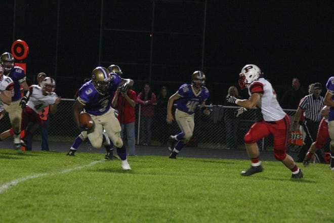 Quinton Reed looks for running room against the Pekin’s defense in Mid-Illini Conference Friday night at Memorial Stadium. The Little Giants improved to 3-1 on the year as they scored two touchdowns in the final eight minutes in beating the Dragons 60-56.