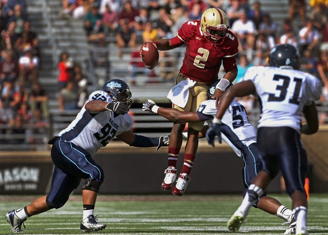 Boston College quarterback Tyler Murphy (2) leaps on one of his several runs Saturday.