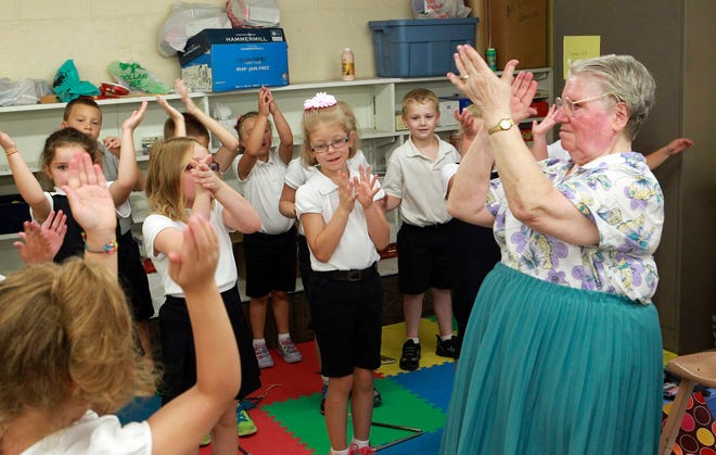 Sister Jeannine Neumann, 80, teaches music to first and second-graders at St. Mary-St. Augustine Catholic School in Belleville. Neumann has taught primary schoolchildren for nearly six decades.