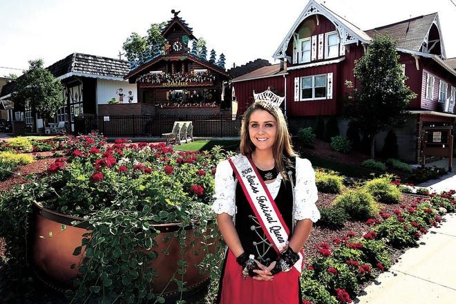2013 Swiss Festival Queen Cayley McCoury shows the giant cuckoo clock on the square in Sugarcreek.