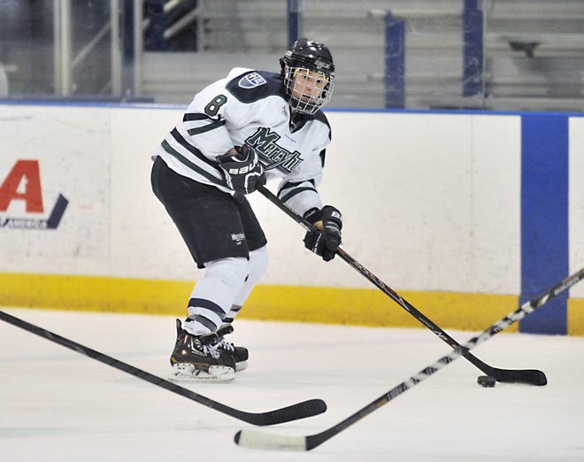 Mercyhurst University's Kaleigh Chippy skates past Robert Morris defenders during the second period of a women's hockey game at the Mercyhurst Ice Center in Erie on Jan. 25. ANDY COLWELL/