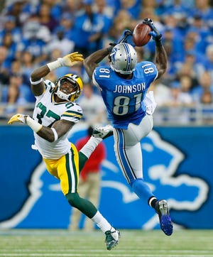 Detroit Lions wide receiver Calvin Johnson (81) makes a catch during the first half in Detroit on Sunday. (AP Photo/Rick Osentoski)