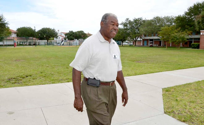 PETER.WILLOTT@STAUGUSTINE.COM Henry White walks through the campus of the Florida School for the Deaf and the Blind on Tuesday, Sept. 16, 2014. White taught at the school for more than 30 years and his father Cary White was the first deaf black student to graduate from the school in 1925.