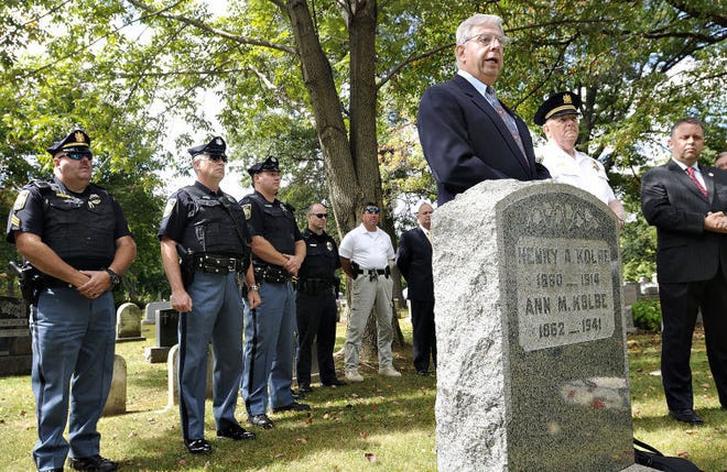 Stu Abramson, President, Doylestown Historical Society stands behind the grave of Contestable Henry Kolbe at the Doylestown Cemetery Monday during a ceremony marking 100 years since Kolbe was killed in the line of duty.