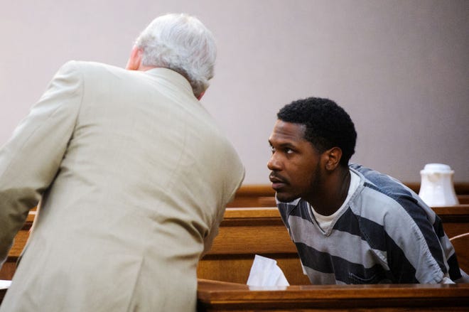 Attorney Stan Clay, left, speaks with his client Lawrence Lawhorn during a Monday court hearing at the Boone County Courthouse. Lawhorn was accused of shooting his half-brother in October. He took a plea deal in which he pleaded guilty to unlawful possession of a firearm and was sentenced to two years in prison.