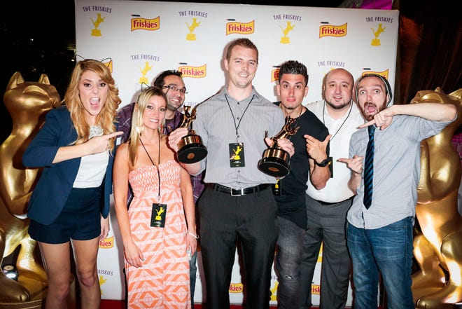 YouTube celebrities The Fine Bros., Grace Helbig, Will Braden, and Jesse Wellens pose with Chris Poole, the Grand Prize winner of "The Friskies" 2014 - awards for the best internet cat videos of the year - for his video titled "Dumpster Kitty" in the "Strange" category. To watch all the winning videos go to www.TheFriskies.com.