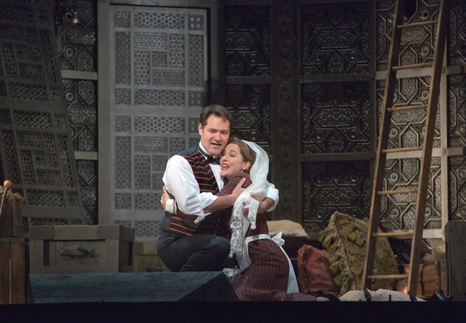 Ildar Abdrazakov as Figaro, left, and Marlis Petersen as Susanna perform in Mozart's "Le Nozze di Figaro" during a rehearsal in New York. Richard Eyre's new production of the opera, conducted by James Levine, opened the Met season on Monday.