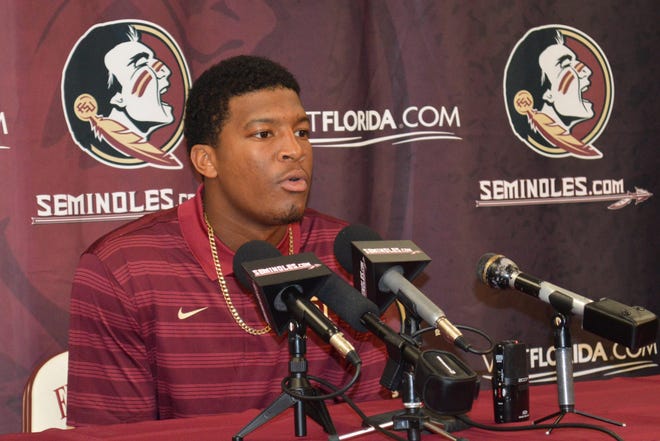 Florida State quarterback Jameis Winston comments on his half-game suspension Wednesday, Sept. 17, 2014, during a news conference at Florida State University in Tallahassee, Fla. The 2013 Heisman Trophy winner apologized for leaping on a table and shouting obscenities on campus. The university benched him for the first half of Saturday's game against Clemson. (AP Photo/Tallahassee Democrat, Bill Cotterell) NO SALES