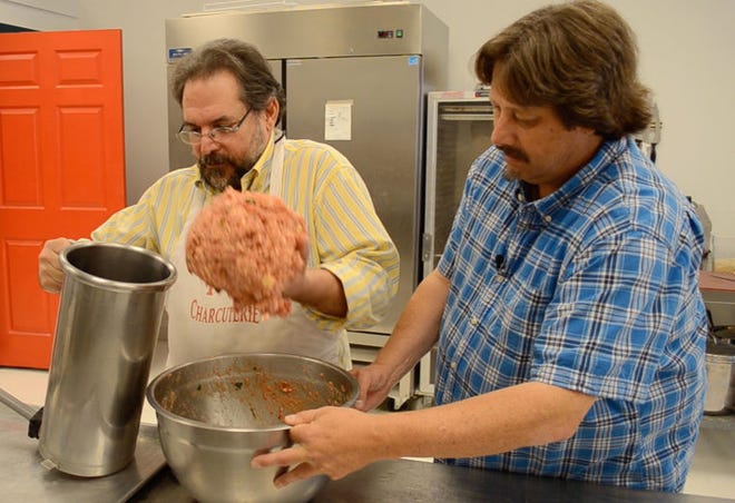 Blair Vanacore (left), owner of the Old World Sausage Factory in Hatboro, and Chuck Thomas prepare sausage during a September "Eat This!" episode.