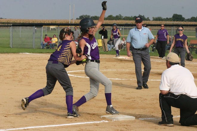 Tori Oaks beats the tag at third base during the regional championship game against Farmington Sept. 17. The Lady Giants won 3-0.