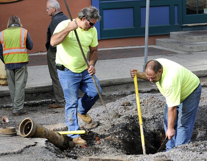Doylestown Borough workers dig out part of Shewell Avenue to get to the water line after PECO patched up a severed gas line on Wednesday morning.