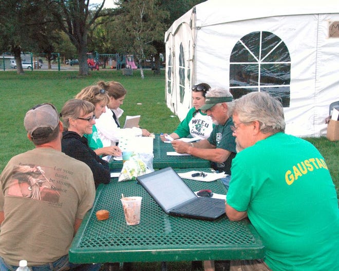 Weed Union Elementary School District trustees and Superintendent Kathi Emerson held their regular meeting Wednesday evening at Bel Air Park in front of the large white tent that housed donations for fire victims.