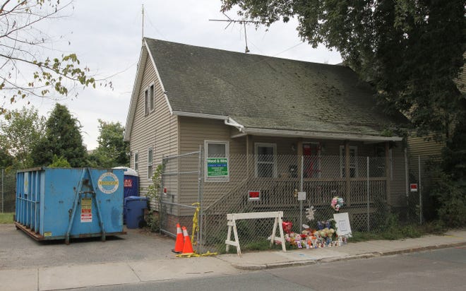 Several dumpsters were filled with foul debris after 90 hours of cleanup at 23 St. Paul St. in Blackstone, Mass., where the remains of three infants were discovered last week. Town officials say the house remains uninhabitable even after the cleanup, and it will be boarded up.
