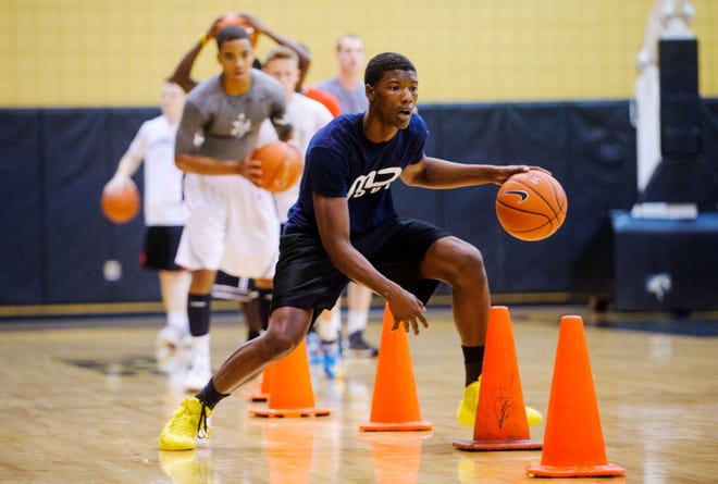 Missouri sophomore Tyus Berry goes through a dribbling drill during walk-on tryouts Wednesday at the Mizzou Arena practice gym. Eleven students took part in the hour-long workout trying to land a spot on the Tigers’ roster.