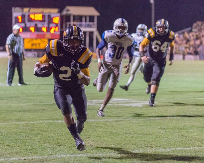 St. Amant running back Nathan Taylor gets out in front of the H.L. Bourgeois defense for a score. Photo by Dewey Keller.