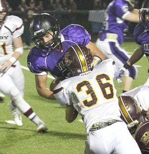 El Paso-Gridley’s John Meinhold takes a hit during last week’s 40-0 win over LeRoy.