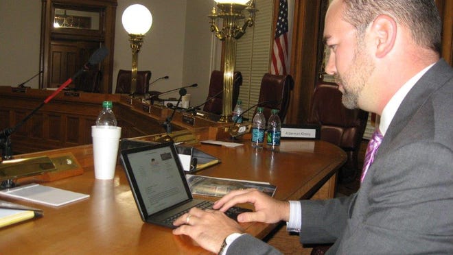 New Bern Aldermen Jeffrey Odham works on his new iPad after Tuesday’s Board of Aldermen meeting. All of the aldermen receive their agendas on the iPads.