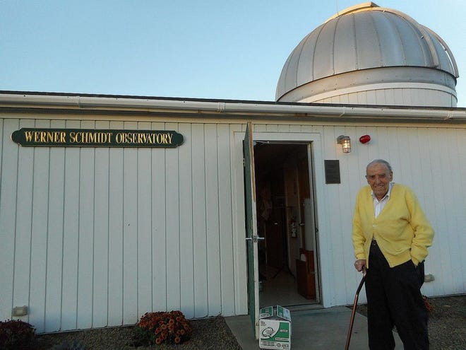 Werner Schmidt in front of the observatory that bears his name.