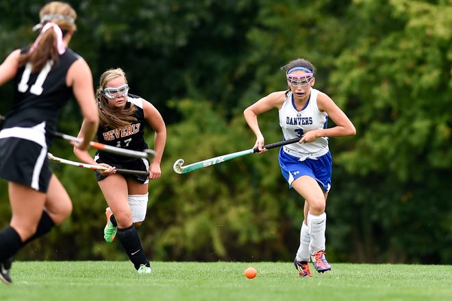 Rhianna Leslie of the field hockey team is being chased down by Beverly's Sierra Gelsomini, while looking to pick up the loose ball during a game at Danvers High School Sept. 16. Wicked Local Staff Photo / David Sokol