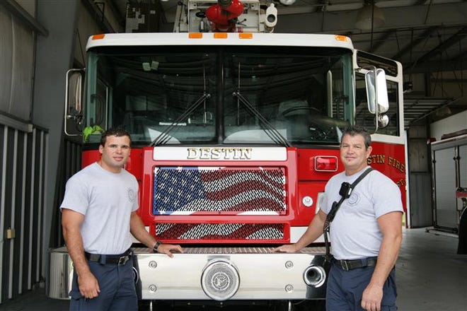 New Destin fire fighters Matt Winkler and Kevin MacDonald stand in Destin Station 9.