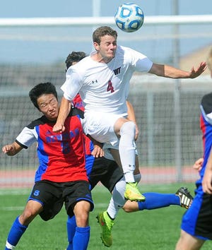 Sean Steffen / Amarillo Globe-News West Texas A&M's Tre Norton gets position on Vitor Okamoto of Newman for a header Saturday, September 27, 2014 during the Buffs 2-0 victory at the Buffalo Sports Complex.