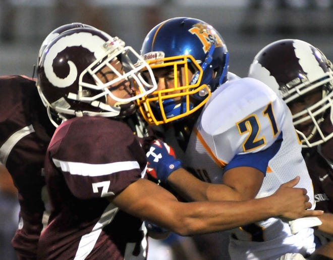 #3 Riverside High School's Christian Furniss stops #21 Chaz Verdon of Maple Shade High School in first quarter action.