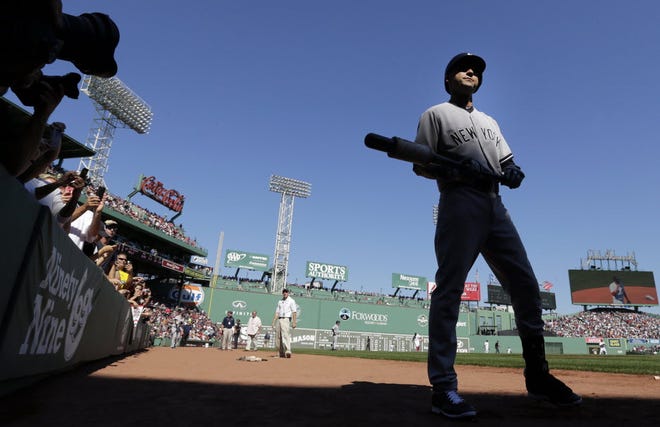 New York Yankees designated hitter Derek Jeter walks to the on-deck circle as he prepares to face the Boston Red Sox in the first inning of a baseball game at Fenway Park in Boston, Saturday, Sept. 27, 2014. (AP Photo/Charles Krupa)
