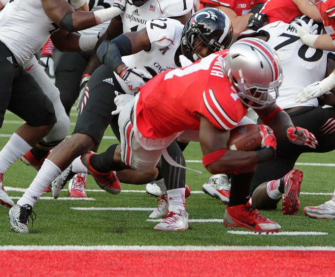 Jay LaPrete/The Associated Press Ohio State running back Rod Smith dives across the goal line for a touchdown against Cincinnati on Saturday.