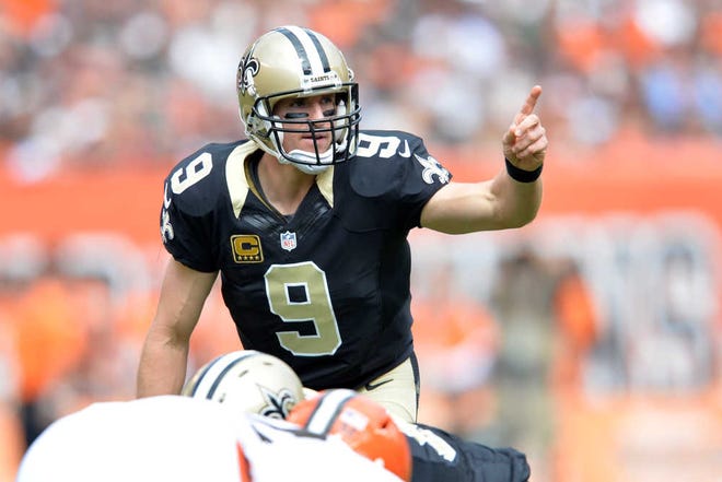 New Orleans Saints quarterback Drew Brees stands at the line of scrimmage during an NFL football game against the Cleveland Browns Sunday, Sept. 14, 2014, in Cleveland. Cleveland won 26-24. (AP Photo/David Richard)