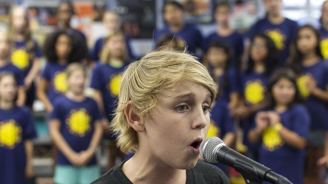 Levi Liles with the Barton Hills Choir sings a solo during rehearsals at Barton Hills Elementary School last week.