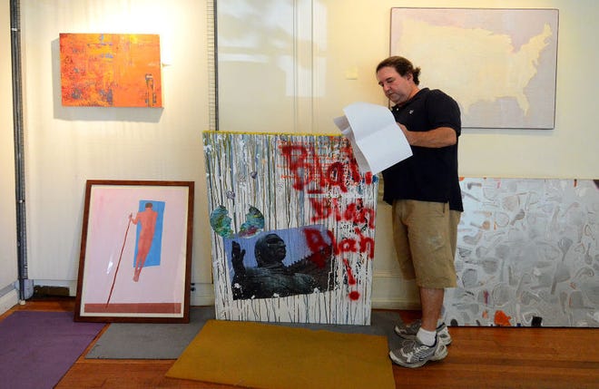 Philip Carroll, curator of exhibits at Perkins Center for the Arts in Moorestown, goes over the works that will be featured in the Creative Tension juried exhibit.