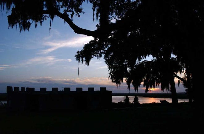 Terry.Dickson@jacksonville.com The sun sets over the Frederica River at Fort Frederica National Monument. The Kings Magazine is in the foreground.