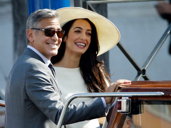 George Clooney and Amal Alamuddin leave Venice's city hall on Monday in Italy Clooney and Amal married Saturday, Sept. 27, the actor's representative said, out of sight of pursuing paparazzi and adoring crowds.