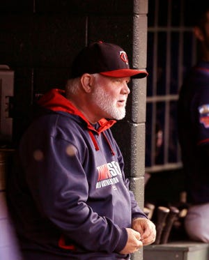 Minnesota Twins manager Ron Gardenhire is seen in the dugout during the first inning of a baseball game against the Detroit Tigers in Detroit, Saturday, Sept. 27, 2014.